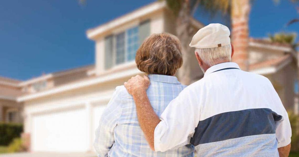 elderly-couple-looking-at-home