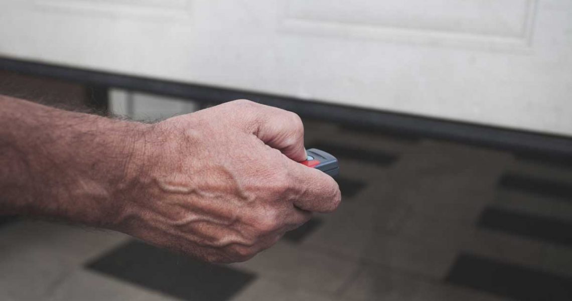 man-opening-garage-door-with-opener